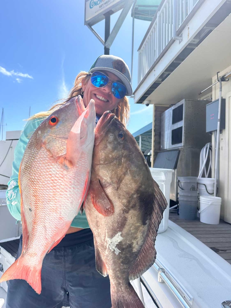 Angler holder a mutton snapper and red grouper
